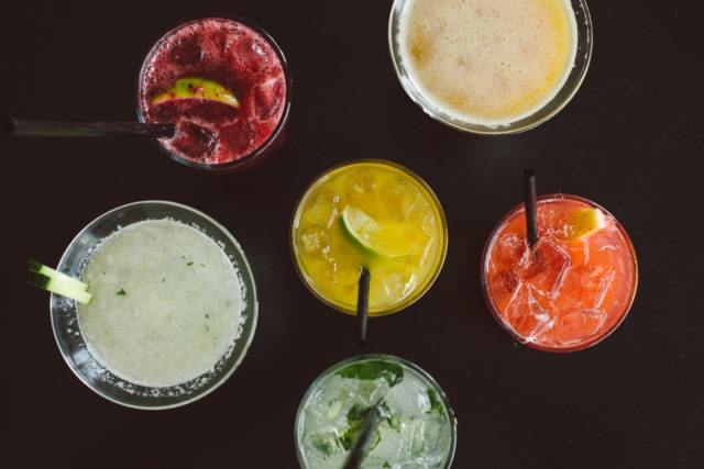 an array of different bar drinks from birds eye view